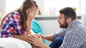 A father comforting a daughter